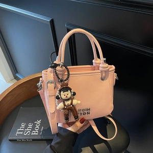 Damen Eimertasche PU Leder Glänzend Schulter Umhängetasche Handtasche Lässig Urban Einfach Mit Cartoon Puppe Anhänger
