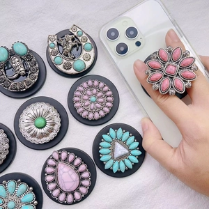 Detailed close-up of bohemian style turquoise pop sockets on a clear phone case