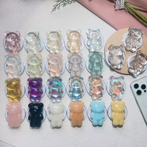 Detailed collection of 24 colorful bear-shaped phone stands in various vibrant acrylic finishes