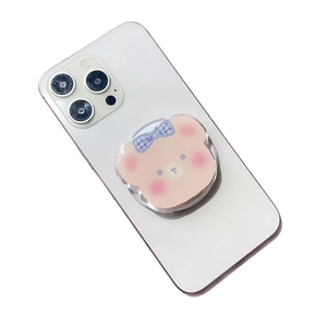 Pink acrylic cartoon bear magnetic phone socket stand on white smartphone