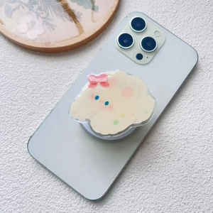 Detail of cute cloud character acrylic phone grip with pink bow on a blue phone case