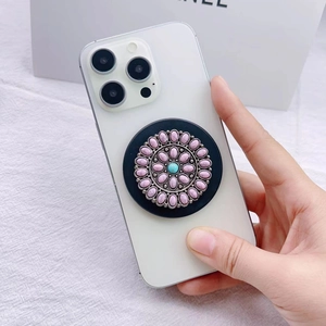 Detailed macro of vintage bohemian phone socket with pink marble and turquoise stone