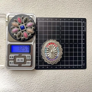 Detailed view of vintage-style turquoise phone sockets with colorful gemstone accents