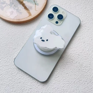 Close-up of minimalist white acrylic cloud phone socket on light green mobile device