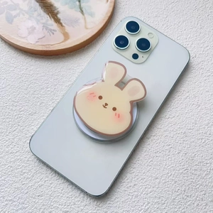 Cute cartoon rabbit acrylic magnetic phone grip stand on a grey smartphone back
