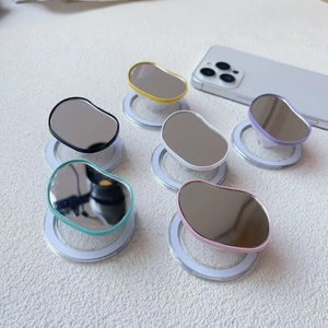 Macro view of six colorful acrylic mirror phone grips in black, yellow, and pastel tones