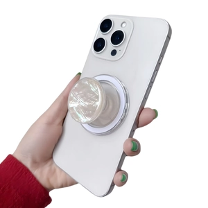 Detail of magnetic phone socket with elegant pearl texture panel and acrylic base