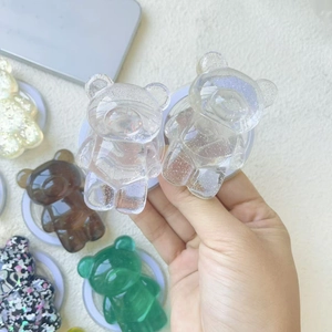 Sparkly glitter bear phone socket grip in various colors including amber and green