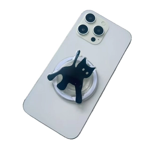 Cute black cat shaped acrylic magnetic phone socket holder on a white mobile phone