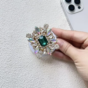 Detail of luxury emerald green rhinestone Magsafe phone grip with crystal embellishments