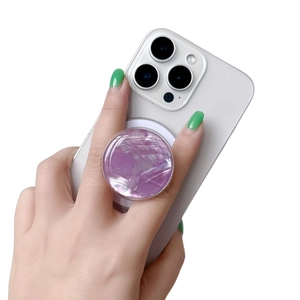 Detail of purple marble pattern phone socket holder with glossy finish on a white smartphone
