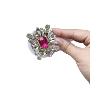 Luxury MagSafe phone grip with rhinestone flower and rose red gem held in hand