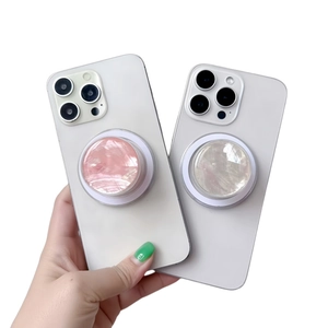 Magnetic cell phone socket grip featuring pink and white marble textures for smartphones