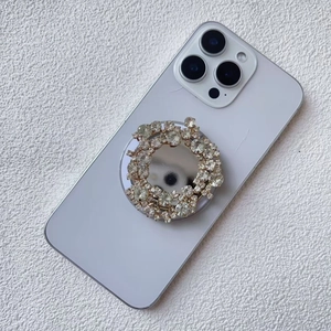 Macro view of crystal rhinestone phone socket with silver mirror finish for grip and support