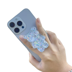 Cute bear phone socket with glitter sequins and magnetic holder on a blue phone case