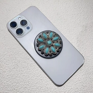 Macro view of vintage style turquoise phone socket with silver floral metal patterns
