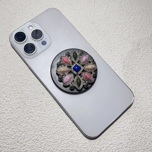 Detail of bohemian popsocket featuring vintage blue stone and colorful mineral inlay