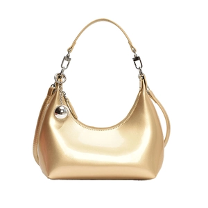 Sac hobo pois doré champagne brillant avec une décoration de breloque en boule argentée
