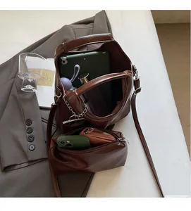 Interior view of brown leather tote showing spacious capacity for tablets and wallets