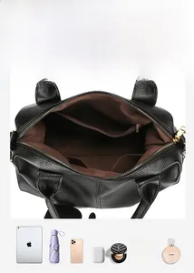 Internal structure of black litchi grain leather bag showing large capacity and compartments