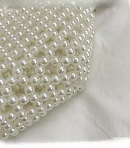 Detailed view of handcrafted white faux pearl weave on a Japanese style crossbody bag