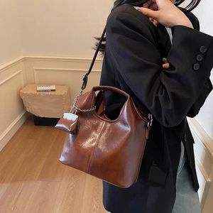 Brown vintage high-gloss leather tote bag with mini pouch and adjustable strap