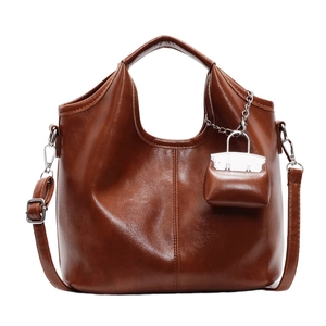 Large vintage brown faux leather tote bag with shoulder strap and mini pouch charm