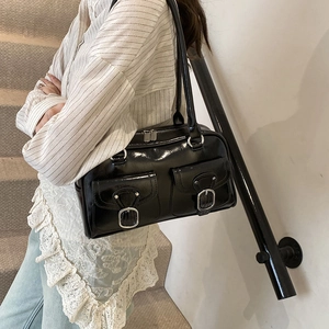 Large black shiny minimalist pillow bag with double pockets and silver metal buckles