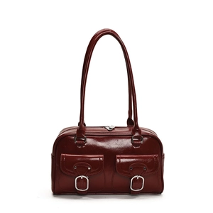 Large burgundy glossy leather pillow bag with double front flap pockets and silver buckles