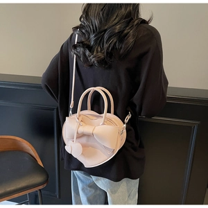 Sac à main rose en forme de cœur avec nœud décoratif et bandoulière pour femme
