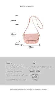 Pink woven texture saddle bag detail with adjustable strap and size specifications