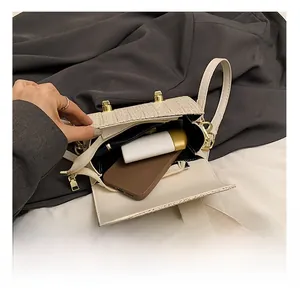 Detail view of woven handbag interior showing spacious main compartment and storage capacity