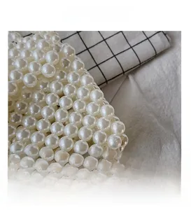 Close-up of handmade white faux pearl weave texture and intricate craftsmanship details