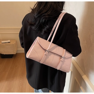Pink minimalist PU leather rectangle shoulder bag with double buckles on black blazer