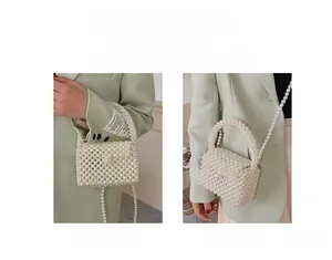 Detailed view of handmade pearl woven crossbody bag with elegant bead strap and flap