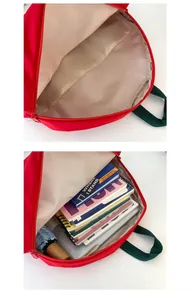 Internal structure of red tomato backpack showing compartments with books and an umbrella