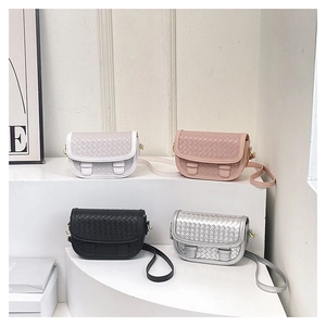 Minimalist saddle bags with woven flap detail shown in four different colors