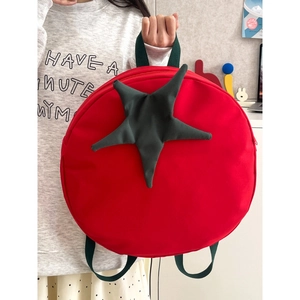 Creative red tomato backpack with green leaf detail and durable canvas straps