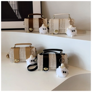 Straw handbag collection featuring leather trim details and fluffy monster charms
