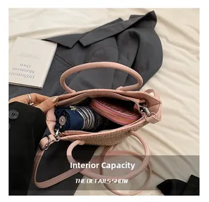 Internal view of pink woven tote bag showing spacious capacity for umbrella and wallet