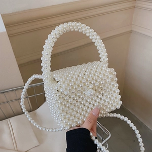 Elegant white beaded pearl crossbody bag with handmade woven handle and chain strap