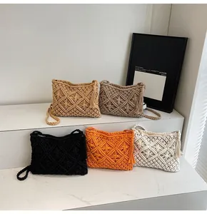 Detailed close-up of knit bucket bags with fringe tassels and diamond hollow weave pattern