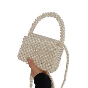Handmade pearl beaded crossbody bag with handle and strap in creamy white finish