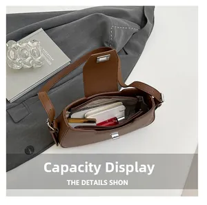 Interior view of brown litchi pattern leather bag showing main compartment and zip pocket