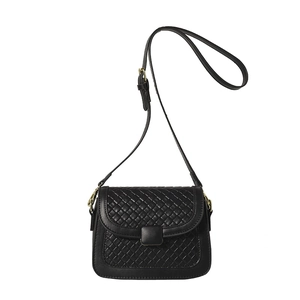 Minimalist black woven flap crossbody bag for women with gold hardware and shoulder strap
