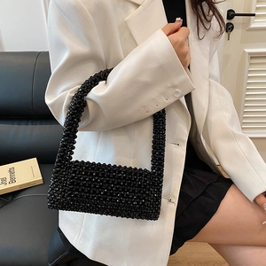 Elegant black beaded handbag with retro cutout design and glossy finish for women