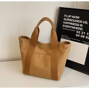 Minimalist canvas tote bag in khaki brown with front pocket and sturdy top handles
