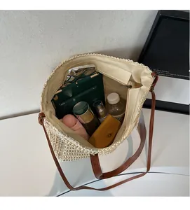 Top view of large straw tote bag interior showing spacious storage for daily items