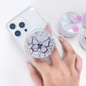 Glittery magnetic phone grip with black butterfly design on a sleek white mobile case