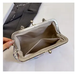 Detailed interior of the crossbody bag showing smooth lining and inner storage pocket